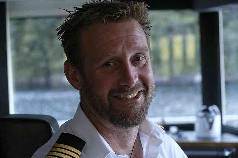 Blake Reid loves his job as captain as he steers guests aboard the Fiordland Navigator in New Zealand. (Florian Sanktjohanser/dpa/TNS)