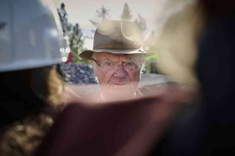 Sweden's King Carl XVI Gustaf speaks to media next to the Kiruna Church, a Sami style wooden Swedish Lutheran church, called Kiruna Kyrka in Swedish, in Kiruna, Sweden, Wednesday, Aug. 20, 2025, after the completion of its move along a 5-km. (3-mile) route east to a new city center as part of the town's relocation.(AP Photo/Malin Haarala)