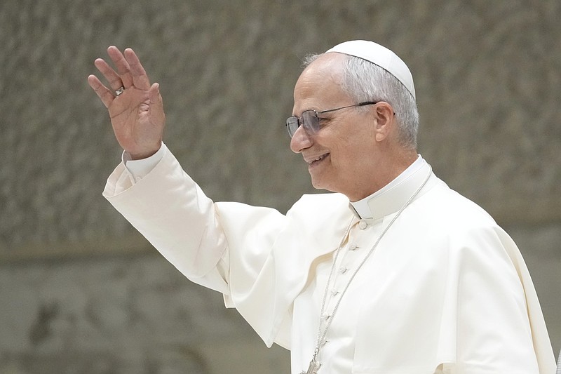 Pope Leo XIV waves as he arrives for his weekly general audience, at The Vatican, Wednesday, Aug.20, 2025. (AP Photo/Gregorio Borgia)