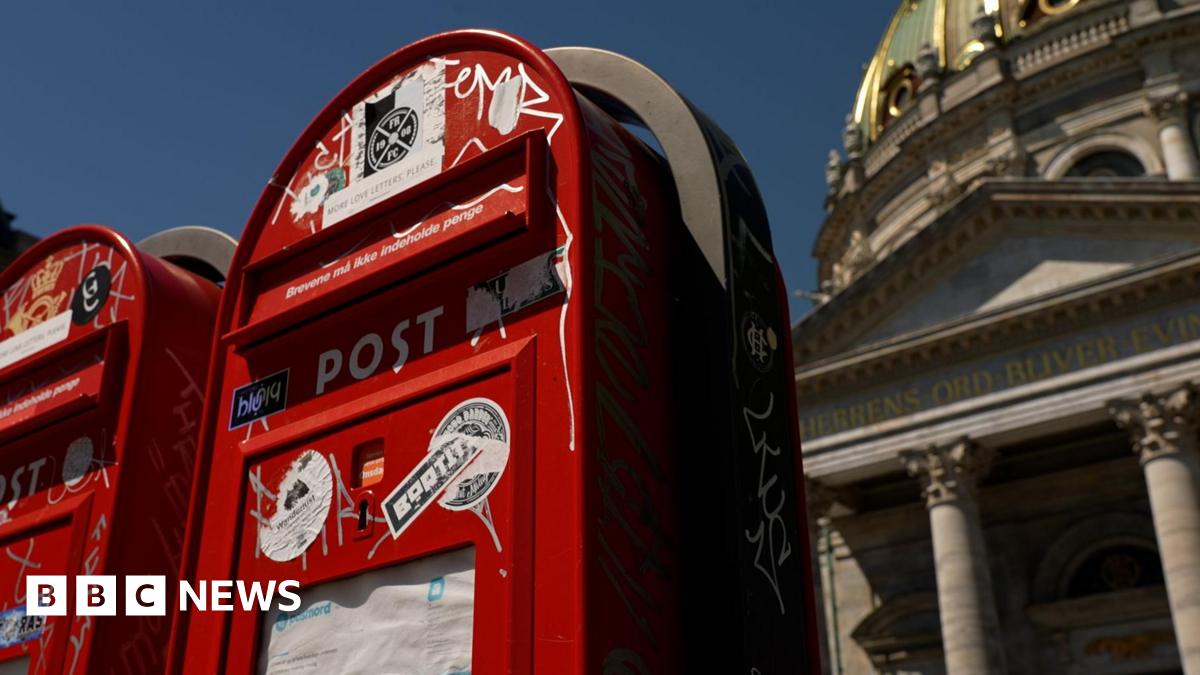 Red post boxes on a street in Copenhagen