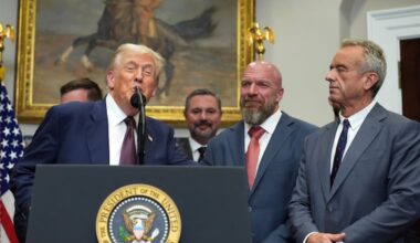 President Donald Trump, from left, speaks as Cody Campbell, WWE CCO Triple H and Health and Human Services Secretary Robert F. Kennedy Jr. listen during an event for the signing of an executive order restarting the Presidential Fitness Test in public schools, Thursday, July 31, 2025, in the Roosevelt Room of the White House in Washington.