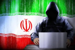 An illustration of a cyber hacker and the Iranian flag. (photo credit: PX Media/Shutterstock)