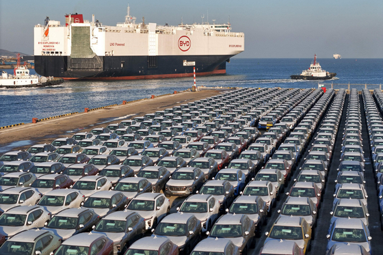 Chinese EVs for export are waiting to be loaded at Yantai port in Shandong Province, eastern China. [AFP/YONHAP]