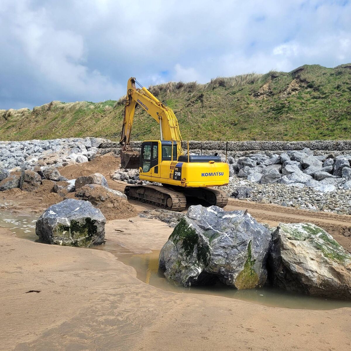 Rock armour and gabion basket protection work at Ballybunion beach near the golf course coastline.