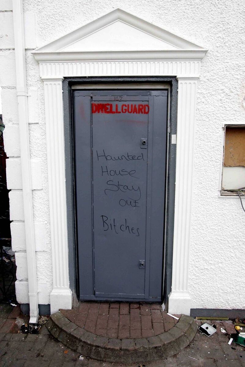 Graffiti on the front door of the 'haunted house' in the Hollywood estate off Blarney Road in the north side of Cork City. File picture: Cillian Kelly