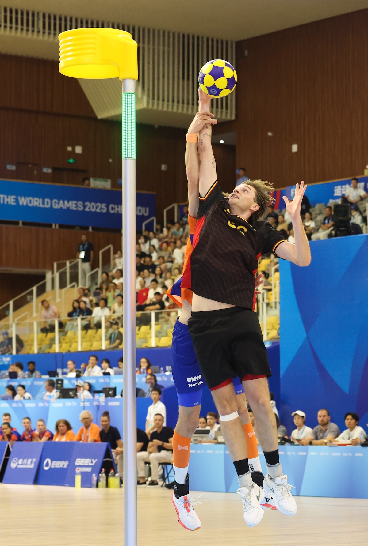 Belgium's Kian Amorgaste fights for the ball during a game against the Netherlands in the final of the Korfball competition of the World Games 2025, in Chenghdu, China, on Tuesday 12 August 2025. This year, the World Games take place from 07 to 17 augustus. BELGA PHOTO VIRGINIE LEFOUR