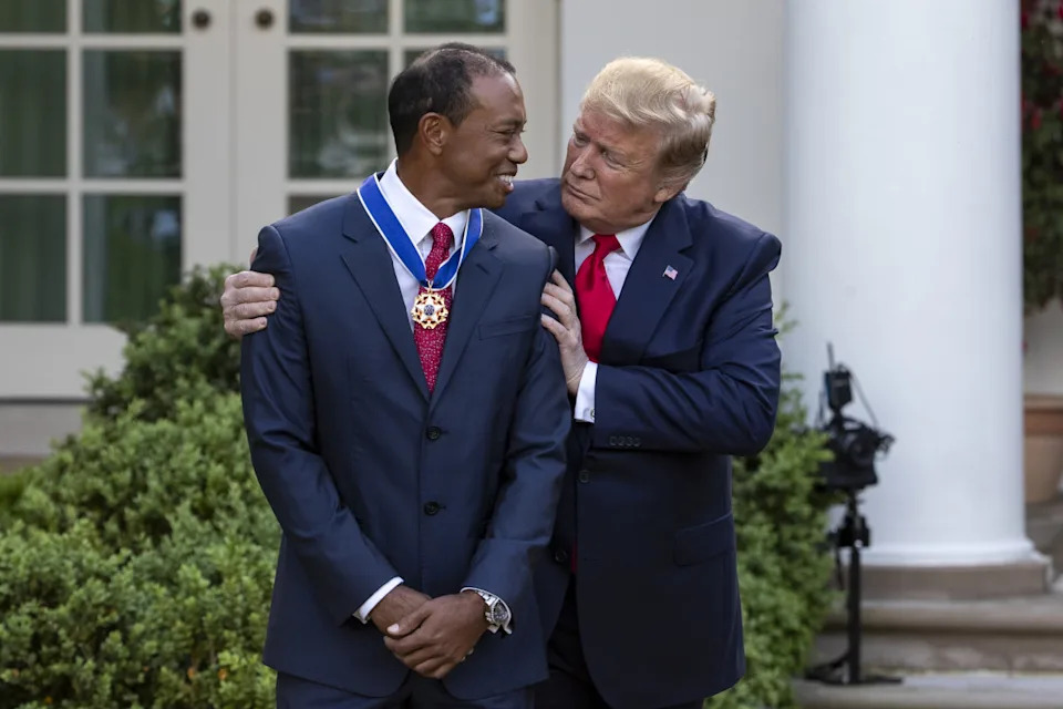 U.S. President Donald Trump embraces Tiger Woods, professional golfer and co-founder of the Tiger Woods Foundation, after presenting him with a Presidential Medal of Freedom award during a ceremony in the Rose Garden of the White House in Washington, D.C., U.S., on Monday, May 6, 2019. Trump announced his plans to bestow the nations highest civilian honor upon Woods after he won this years Masters Tournament, his first major title in more than a decade. Photographer: Alex Edelman/Bloomberg via Getty ImagesBloomberg/Getty Images
