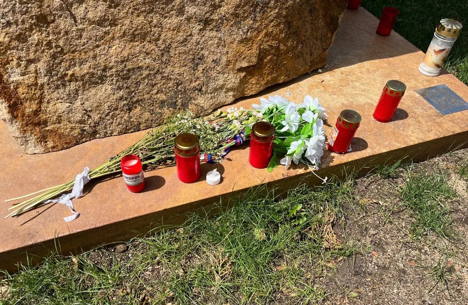Czechs often leave items at the memorial to shooting victims.