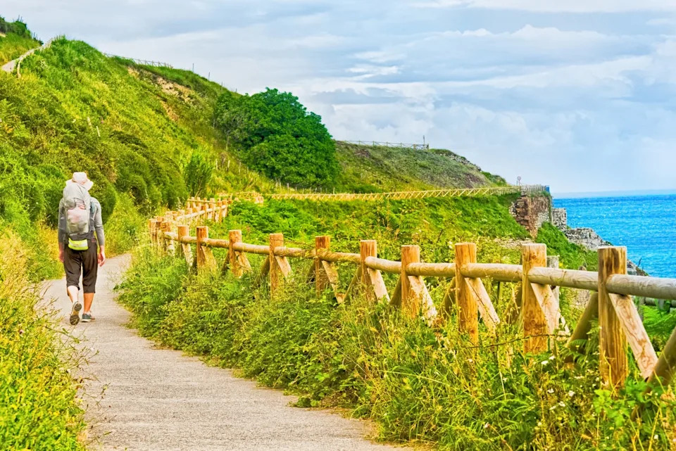 Lonely Pilgrim with backpack walking the Camino de Santiago in Spain, Way of St James (Getty/iStock)