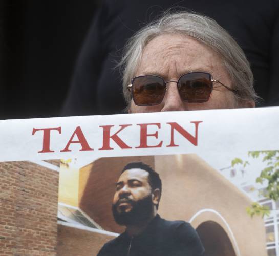 GAZETTE FILE PHOTO Organizer Pat Aslin holds a sign during a “Silent Bearing Witness” outside Northampton City Hall, June 26. 