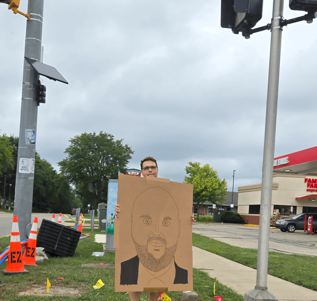 This guy stands solo on the corner in my city displaying his homeade signs