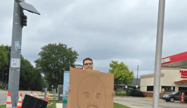 This guy stands solo on the corner in my city displaying his homeade signs