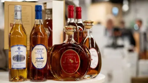 Getty Images Bottles of French cognac displayed at an independent winegrowers fair in Paris, France, on Friday, March 21, 2025
