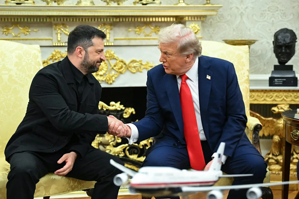 Ukrainian President Volodymyr Zelensky and President Trump shake hands during a meeting in the Oval Office.