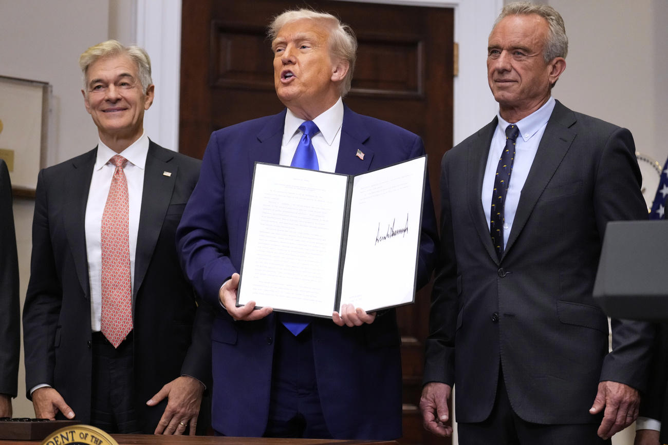 three men with an executive order