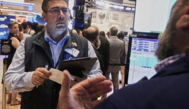 Wall Street hovers near records as markets take in earnings ahead of Powell speech Friday | Business