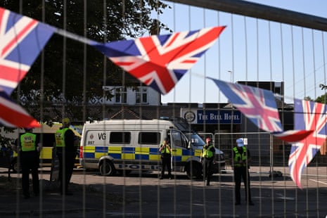 Police officers guard the entrance of the Bell hotel in Epping during a demonstration earlier this month.