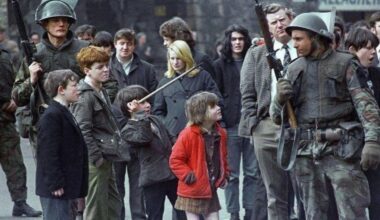 Irish children tease British soldiers. Derry, 1972.