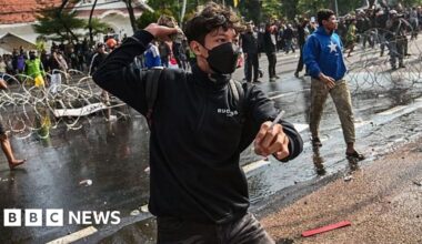 Three dead after protests over death of taxi driver in Indonesia