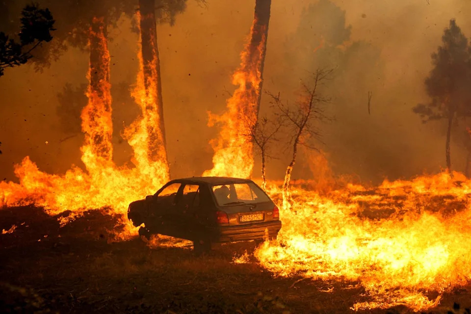 A car burns during the wildfire, in Meda, Portugal, August 15, 2025 (Reuters)
