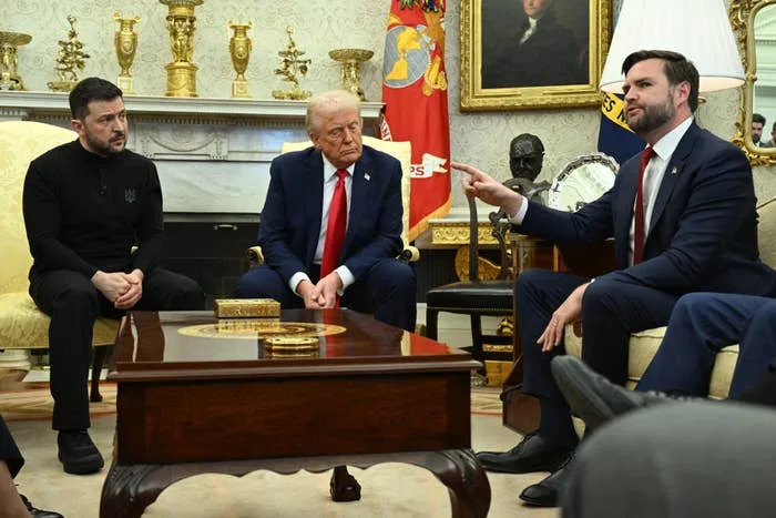 US President Donald Trump and Ukraine's President Volodymyr Zelensky listen to Vice President JD Vance (R)as they meet in the Oval Office