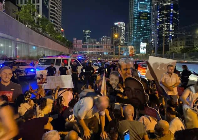 Protesters gather at the Ayalon Highway. (photo credit: AVSHALOM SASSONI)