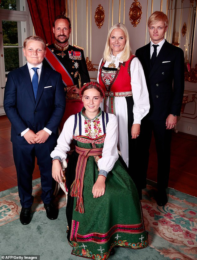 Princess Ingrid Alexandra (front) is pictured with the Norwegian royal family, including her half-brother Marius Borg Høiby (back right). Also pictured is Ingrid Alexandra's brother Prince Sverre Magnus (left), father Crown Prince Haakon (back left) and mother Crown Princess Mette-Marit (back centre). This photo was taken in 2019 in Oslo, Norway