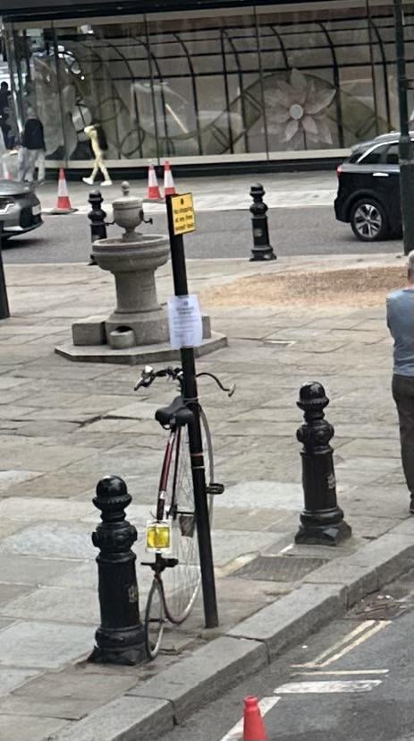 Penny Farthing with a parking enforcement notice