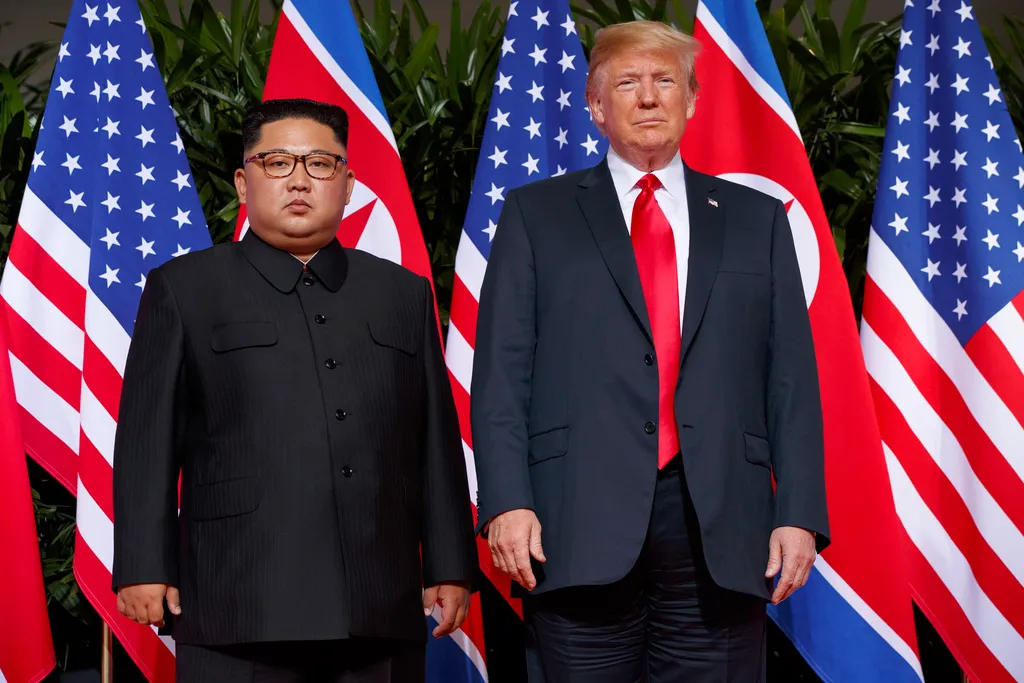 President Donald Trump, right, meets with North Korean leader Kim Jong Un on Sentosa Island, in Singapore, June 12, 2018. 