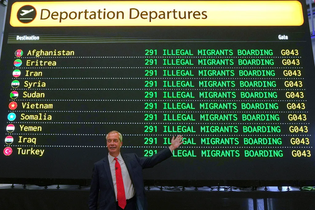 British Reform UK party leader Nigel Farage poses in front of a mock departures board during a press conference in a hangar at Oxford Airport in Kidlington, England, Tuesday, Aug. 26, 2025.