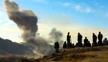 FILE - In this Nov. 19, 2001 file photo, Northern Alliance soldiers watch as U.S. air strikes attac...