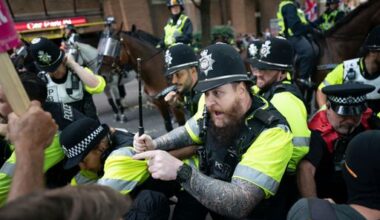 Anti-migrant, anti-racism groups clash at UK asylum hotel