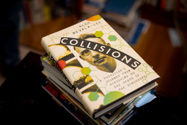 Alec Nevala-Lee's new book "Collisions: A Physicist's Journey from Hiroshima to the Death of the Dinosaurs," in his Oak Park home office on June 9, 2025. (Brian Cassella/Chicago Tribune)