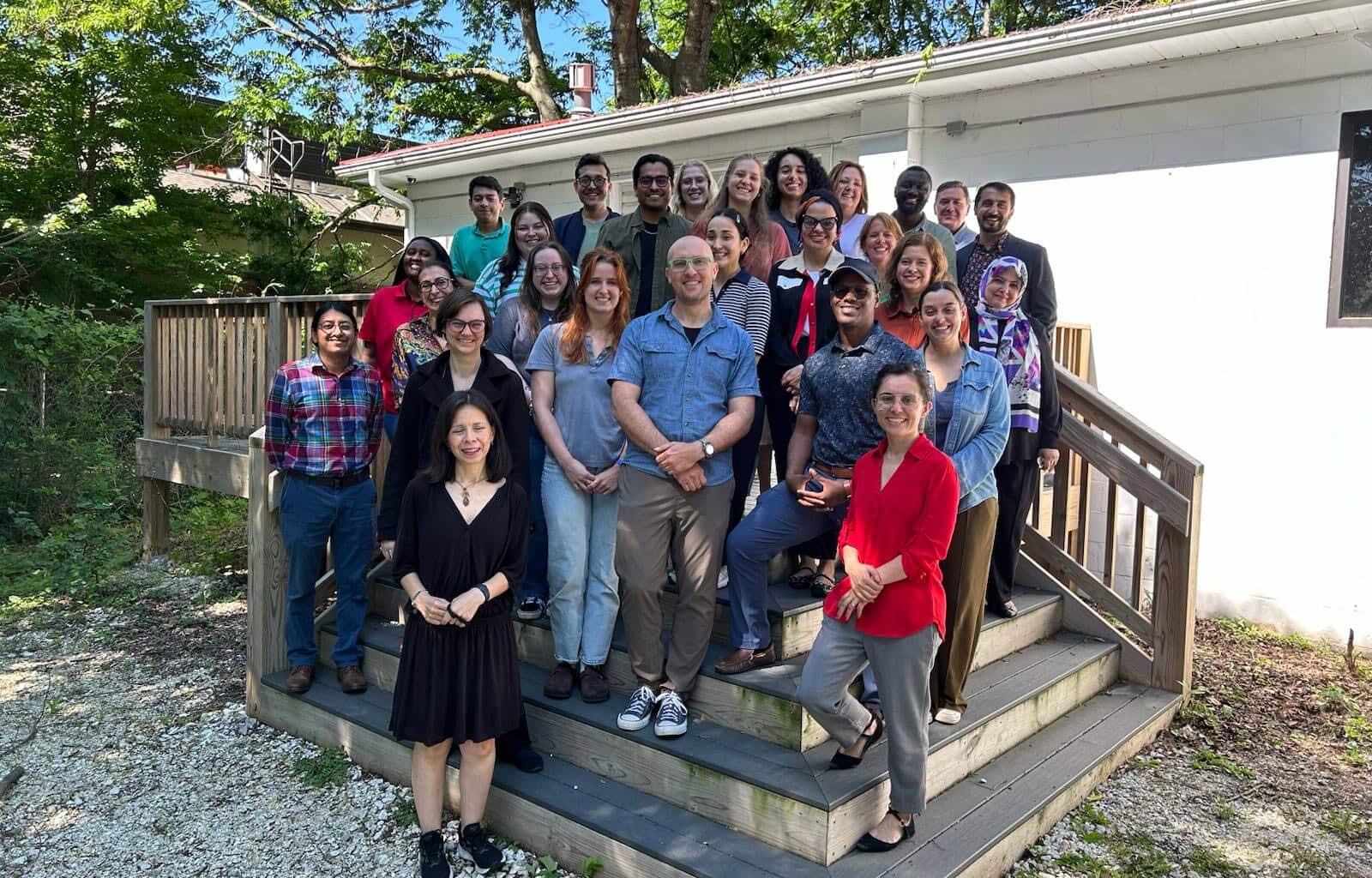 Photo of Caroline Geels with Canopy NWA staff and refugee families