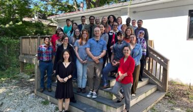 Photo of Caroline Geels with Canopy NWA staff and refugee families