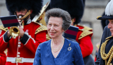 Princess Anne wears a pearl necklace and blue dress