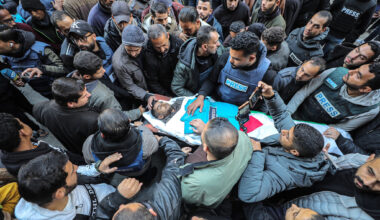 Family and friends mourn near the body of Palestinian journalist Saed Sabri Abu Nabhan, who was shot and killed by an Israeli army sniper, at Al Awda Hospital in northern Gaza, January 11, 2025. (Ali Hassan/Flash90)
