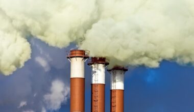 Smoke coming out of 3 chimneys.
