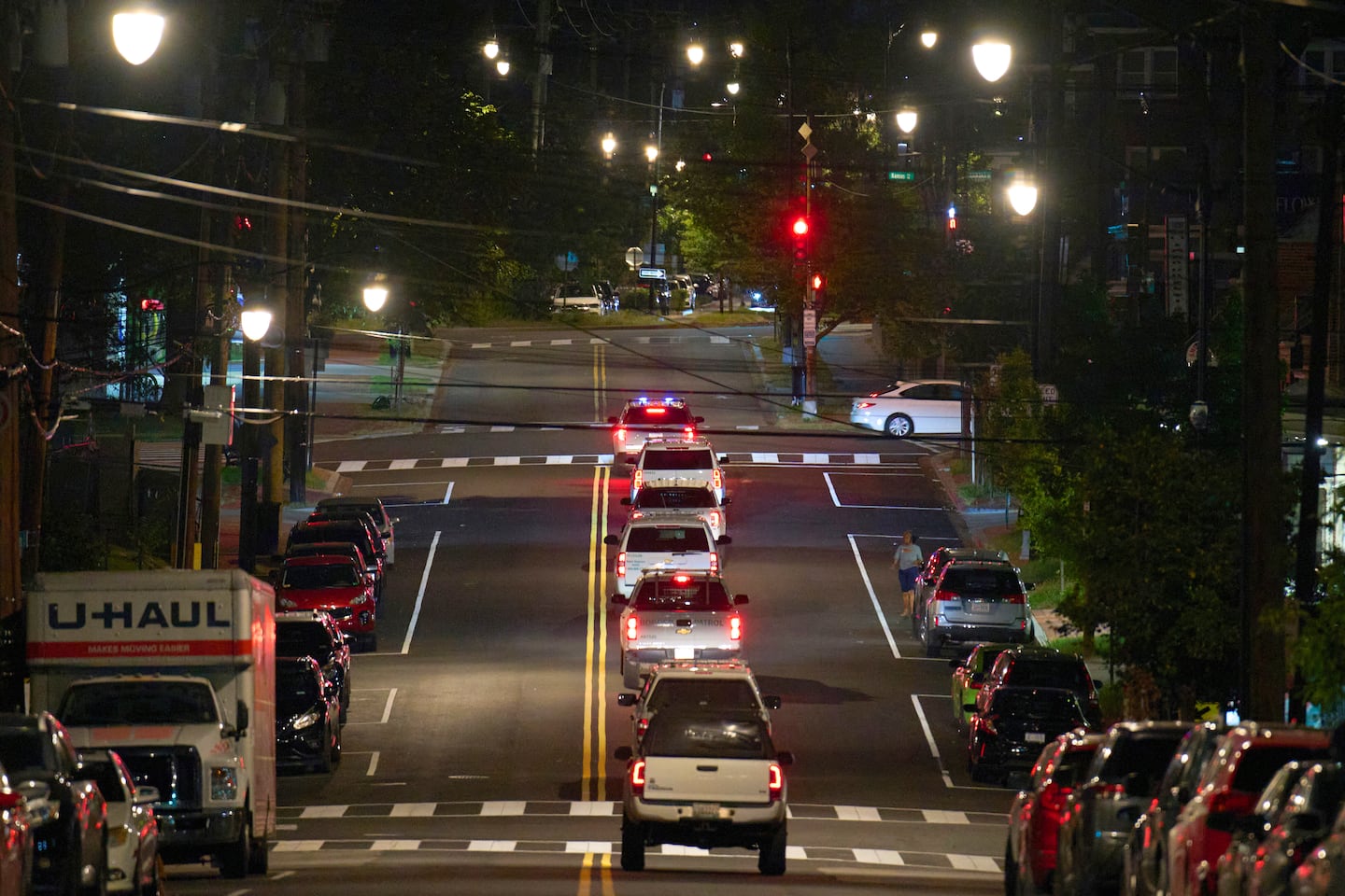 Vehicles with law enforcement agents from the US Customs and Border Protection as well as Metropolitan Police drive along Kennedy Street NW, in the early morning of Wednesday, Aug. 13, 2025, in Petworth neighborhood of Washington.