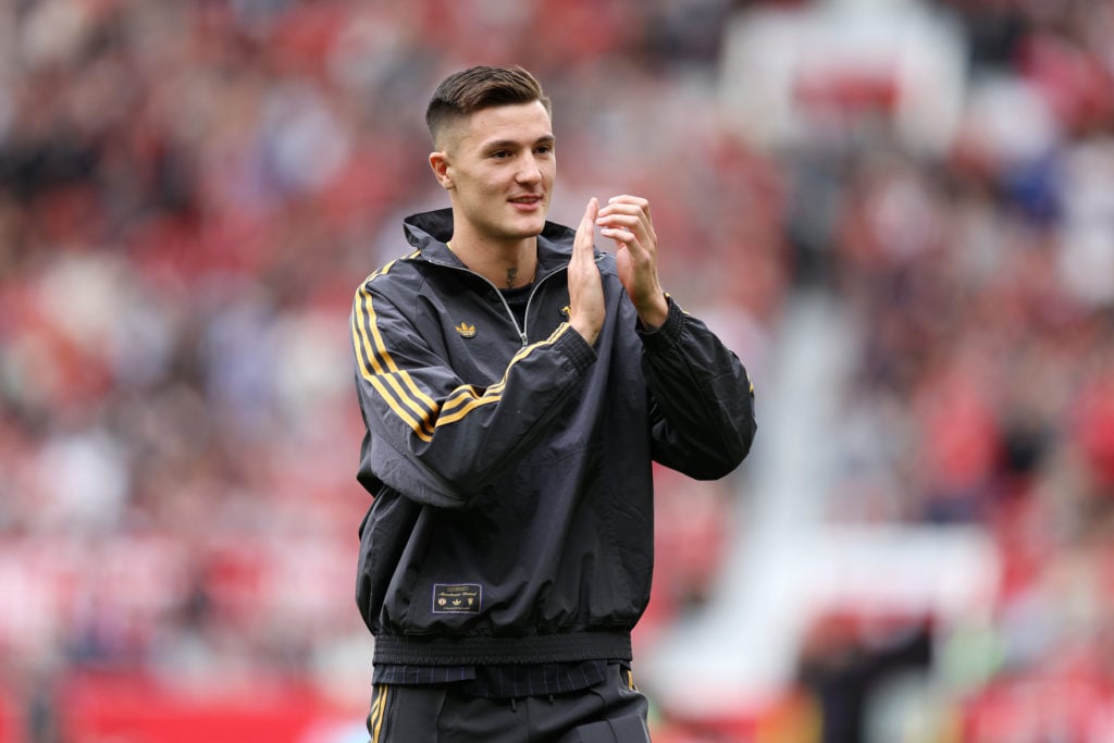 Former RB Leipzig striker Benjamin Sesko acknowledges the Manchester United fans ahead of the pre-season friendly match between Manchester United and Fiorentina at Old Trafford in 2025 in Manchester, England.