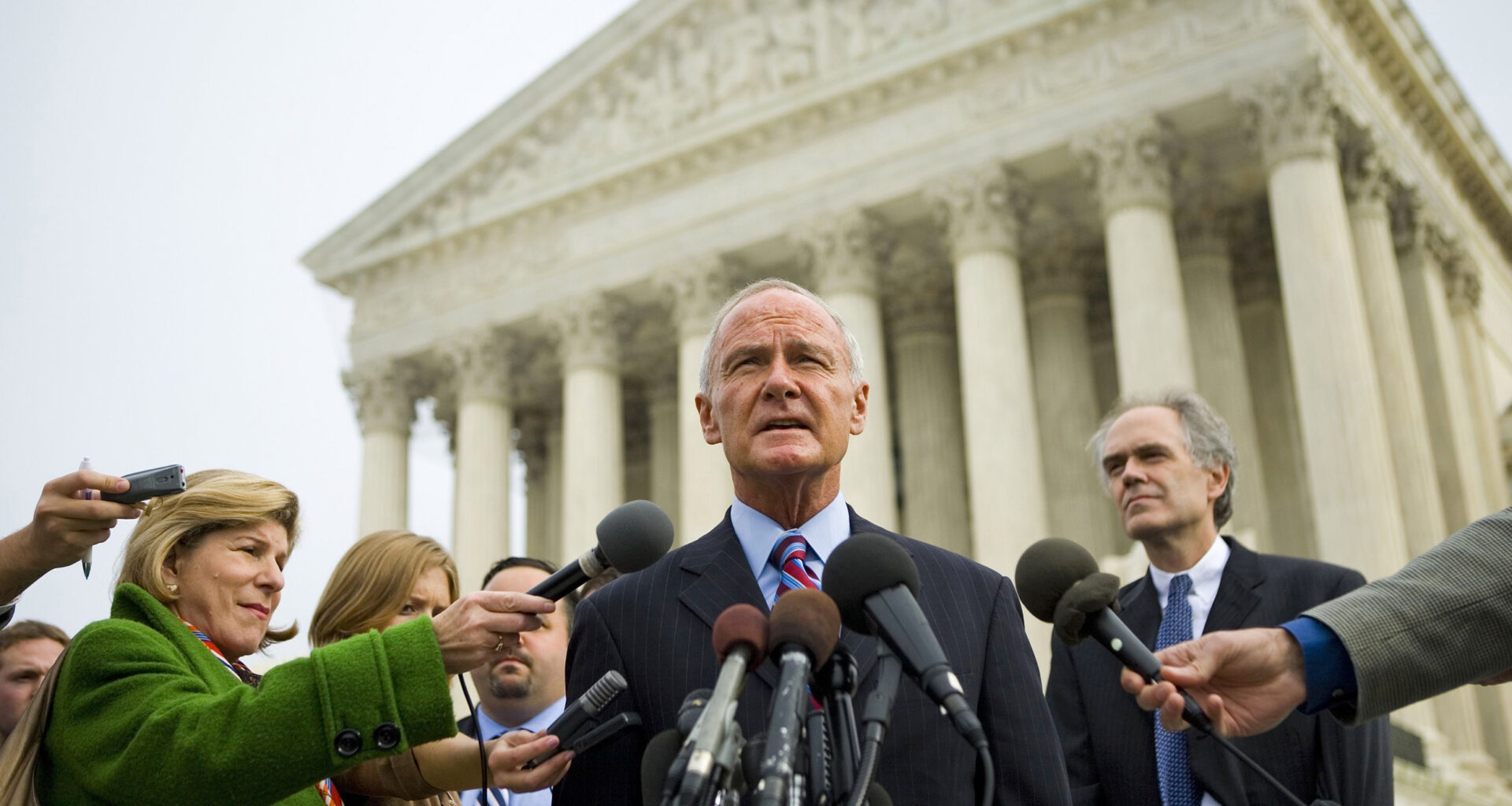 Then Massachusetts Attorney General Tom Reilly speaks to reporters outside the U.S. Supreme Court on Nov. 29, 2006, as states argued against the EPA’s inaction on global warming. Credit: Brendan Smialowski/Getty Images