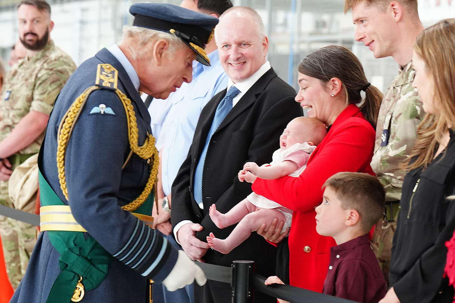King Charles Laughs Off Baby's Less-Than-Thrilled Reaction to Meeting Him