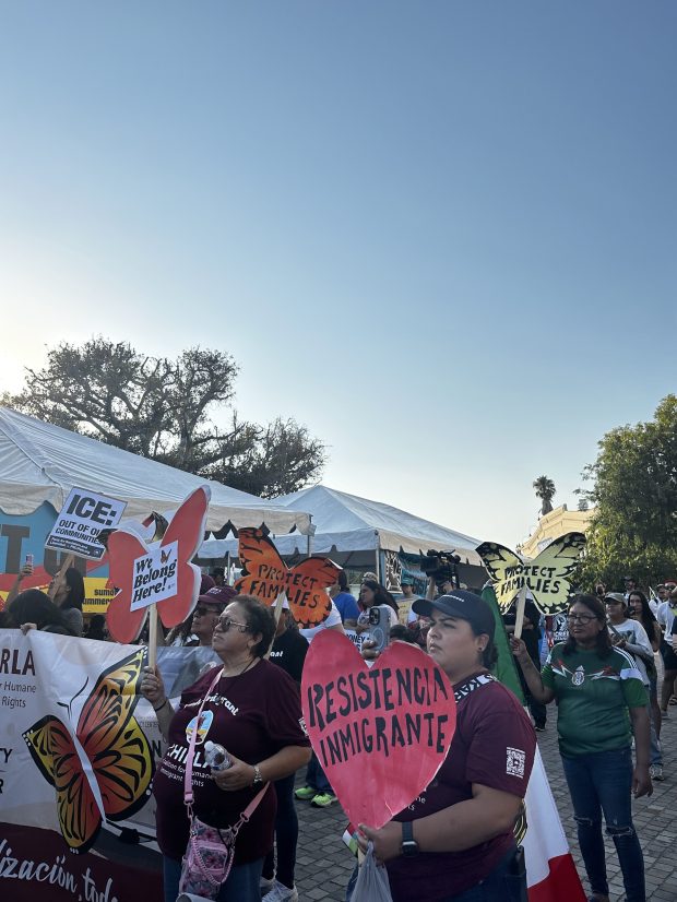 Protesters hold signs in support of people who have been...