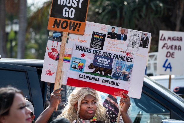 Immigrant rights advocates rally at MacArthur Park on Tuesday, Aug....