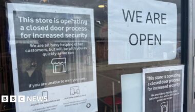 Mobile phone shops lock doors while open after raid