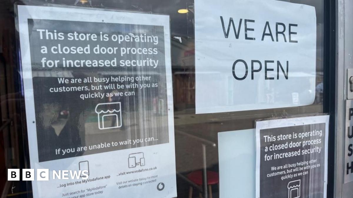 Mobile phone shops lock doors while open after raid