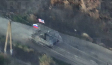 Russian vehicle with Russian and USA flags is getting damage during the assault on Ukrainian positions in Zaporizhya region
