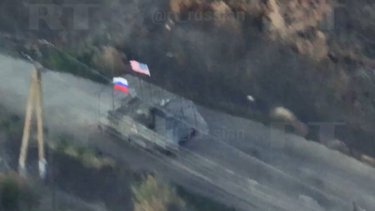 Russian vehicle with Russian and USA flags is getting damage during the assault on Ukrainian positions in Zaporizhya region