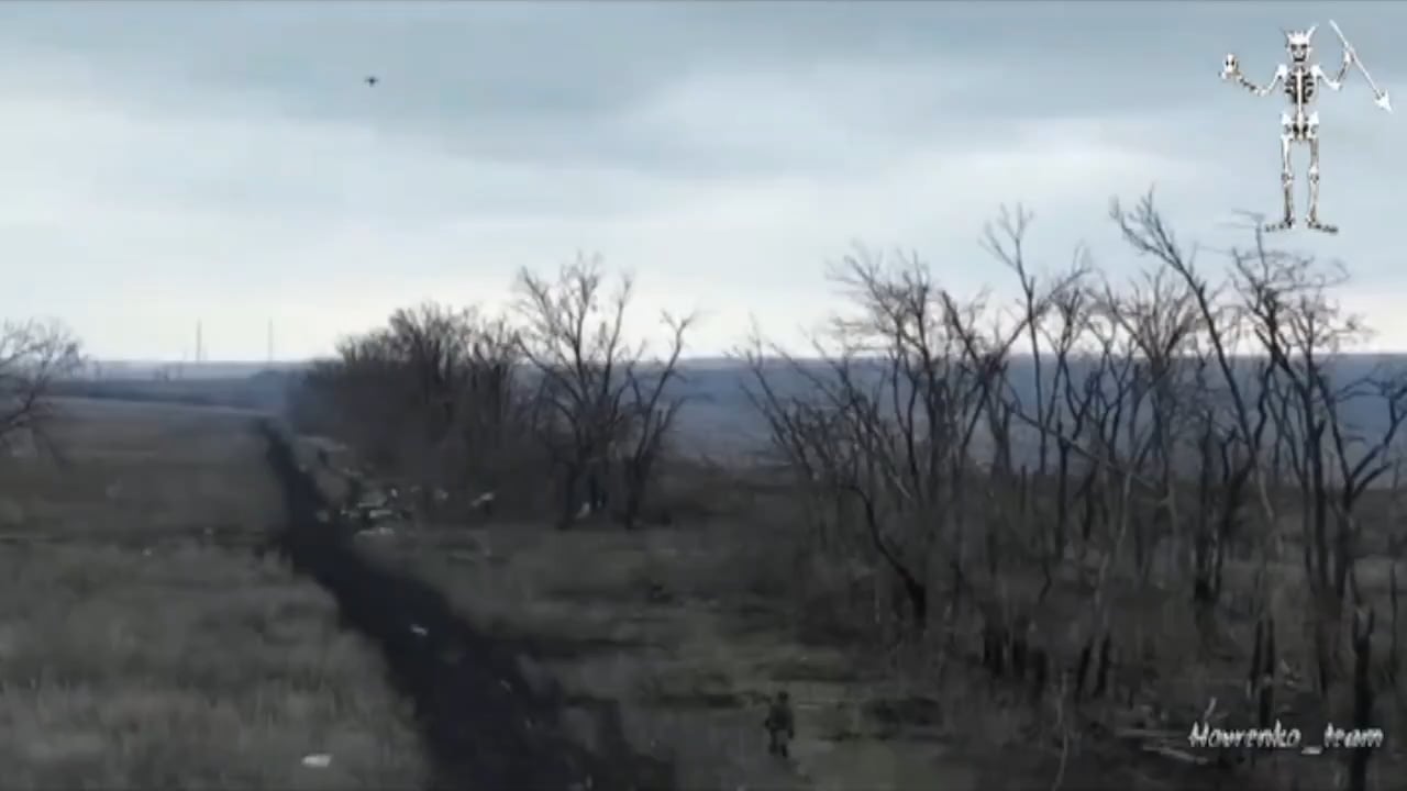 An exhausted Russian infantryman tries to surrender to a Ukrainian drone and is following the UAV. Suddenly a Russian drone appears and drops a grenade on their own surrendering soldier. After the impact, he still crawls forward, still following the Ukrainian UAV.