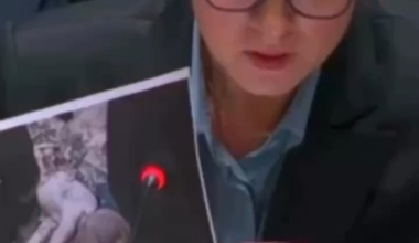At the UN Security Council, Ukraine’s PM shows a photo of a child killed in Russia’s airstrike on Kyiv while the Russian delegate looks at her phone.